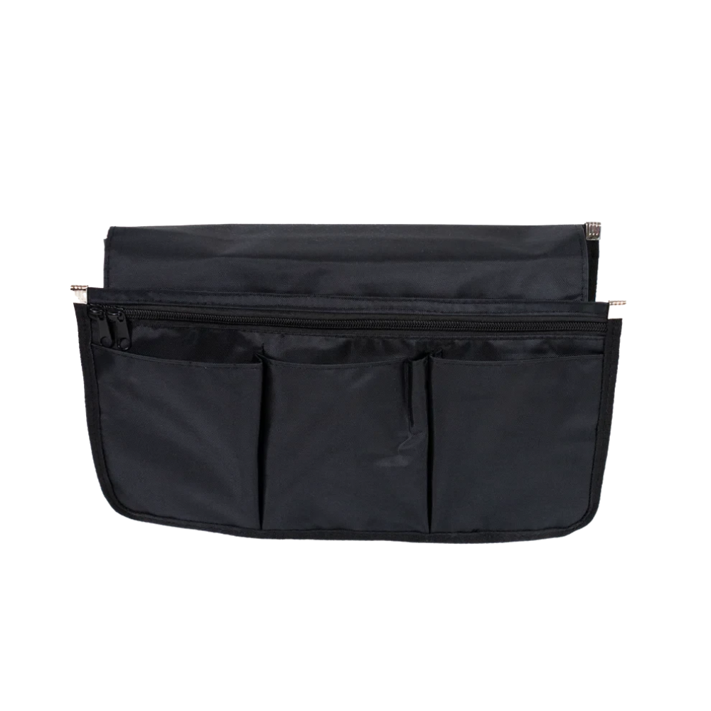 Detailed view of the five individual storage pockets on the Travel Buggy wheelchair armrest organizer.
